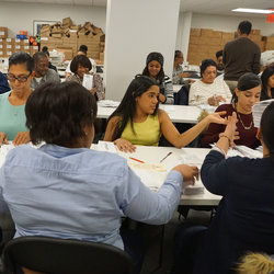 AAA staffers open ballot envelopes in preparation for scanning on Feb 15th.