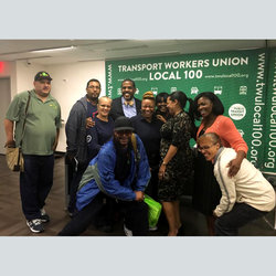 Stations VP Derrick Echevarria (at left) stands with bill supporters including State Sen. Kevin Parker (center), rank and file union members, and City Councilwoman Julissa Ferreras