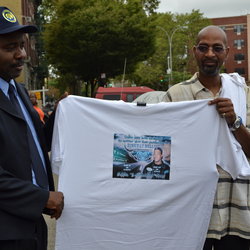 Gleason Depot Chair Whitfield Gibson holds a memorial t-shirt