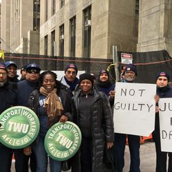 Local 100 outside Manhattan courthouse where a judge posthumously dismissed the case against CTA Goodwin