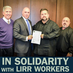 TWU Local 100 President John Samuelsen and UTU General Chair Anthony Simon hold TWU’s letter of support for LIRR unions in the event of a strike, as Joel Parker (left) and Arthur Maratea of the TCU look on.