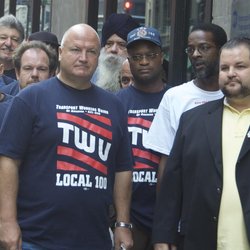 Bob Crow, left, wearing a TWU Local 100 t-shirt, joins Local 100 President John Samuelsen, right, outside MTA headquarters in 2010.
