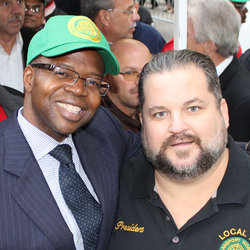 Brooklyn D.A. Thompson stands with President Samuelsen at Oct. 29, 2013 rally