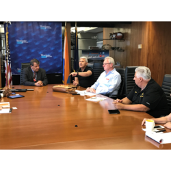 President Utano (at right) listens as Carlos Barnabel makes a point to W'Chester Exec George Latimer today.