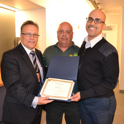Train Operator Omar Velez is recognized by Chief of Subways Joe Leader and Local 100 RTO Chair Joe Costales