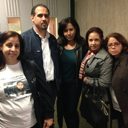 William's brother Alex, center, stands with family including widow Nancy Rodriguez, far right.