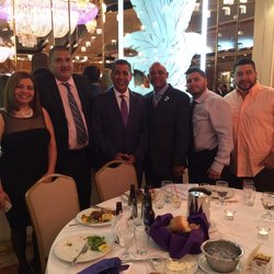 Sen. Espaillat flanked by union officers and rank and file at the LCLAA dinner on April 8