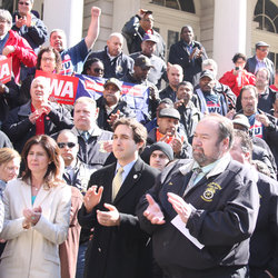 Local 100 members were in the crowd protesting at City Hall