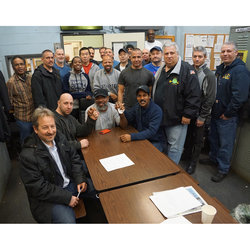 Scribe Pete Donohue (left foreground) with LES Chair John V. Chiarello, MOW VP Tony Utano and, seated, the three who made the difference for a supervisor.