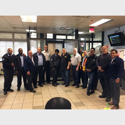 Local 100 President Tony Utano (center) with Secretary Treasure Earl Phillips, Administrative Vice President Nelson Rivera, RTO Vice President Joe Costales, Conductor/Tower Division Chair Crystal Young and RTO members stand in front of the new union office at Stillwell Avenue crewroom.