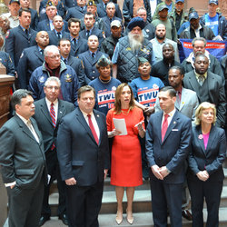 Assemblywoman Amy Paulin, Co-Sponsor, other politicians, and TWU and Union members on the steps in Albany's state house supporting the bill.